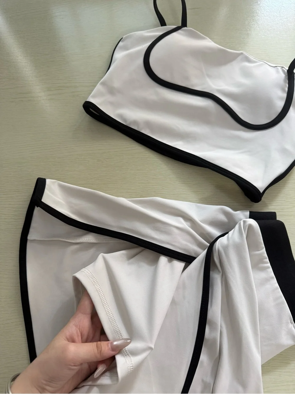 ALO Yoga Cream Sports Bra and Skort with Black Trim - Picture 6 of 6